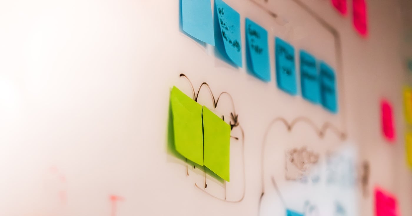 UX research sticky notes on a whiteboard representing data-driven design decisions